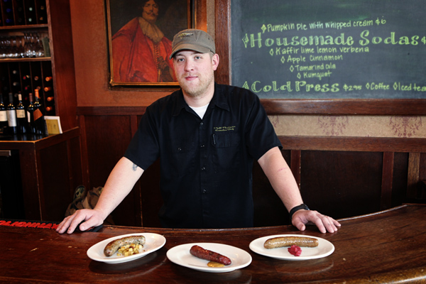 Matt Paulson of Sample Room with three housemade sausages