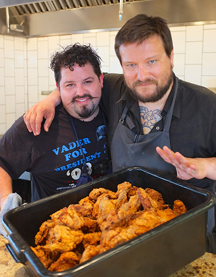 Chefs Mike Brown and Erik Anderson with an extra large bucket