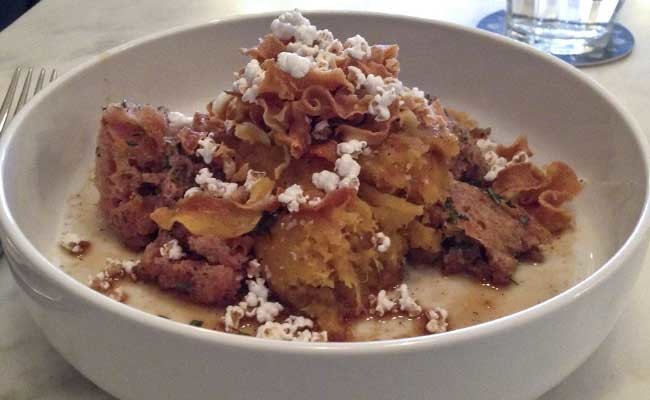 Roasted acorn squash with puffed sorghum from Saint Genevieve.