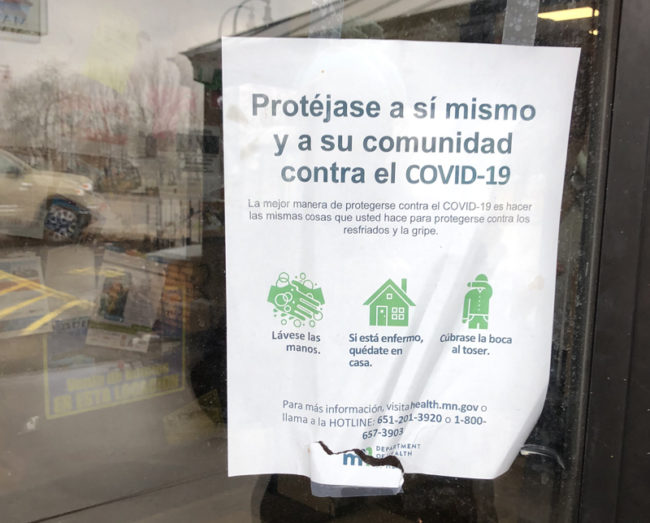 Sign in Spanish about the Covid-19 pandemic at La Alborada Supermercado on East Lake Street in Minneapolis